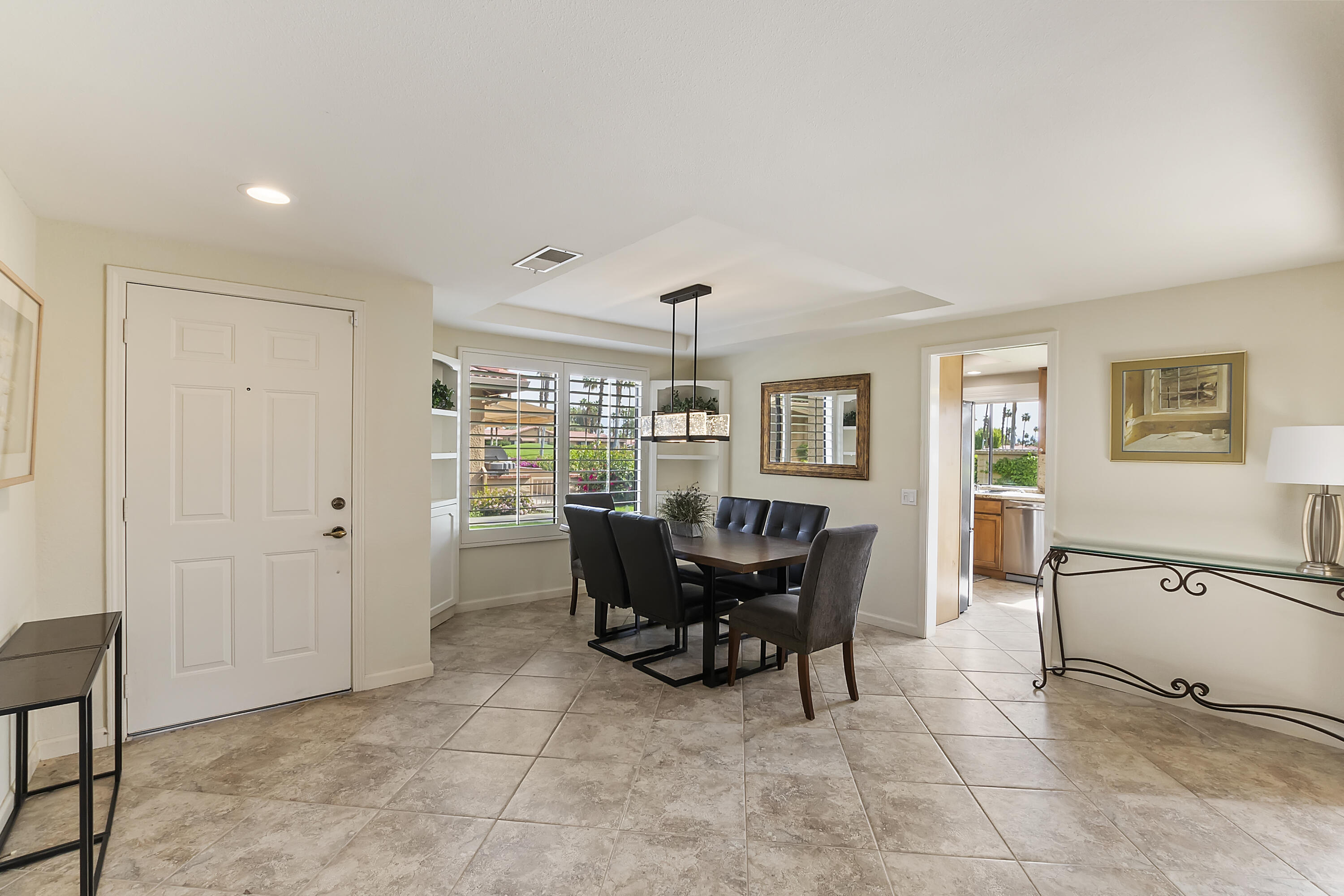 6 Maximo Way Palm Desert, CA 92260 - Photo 8 of 48 a view of a dining room with furniture and chandelier
