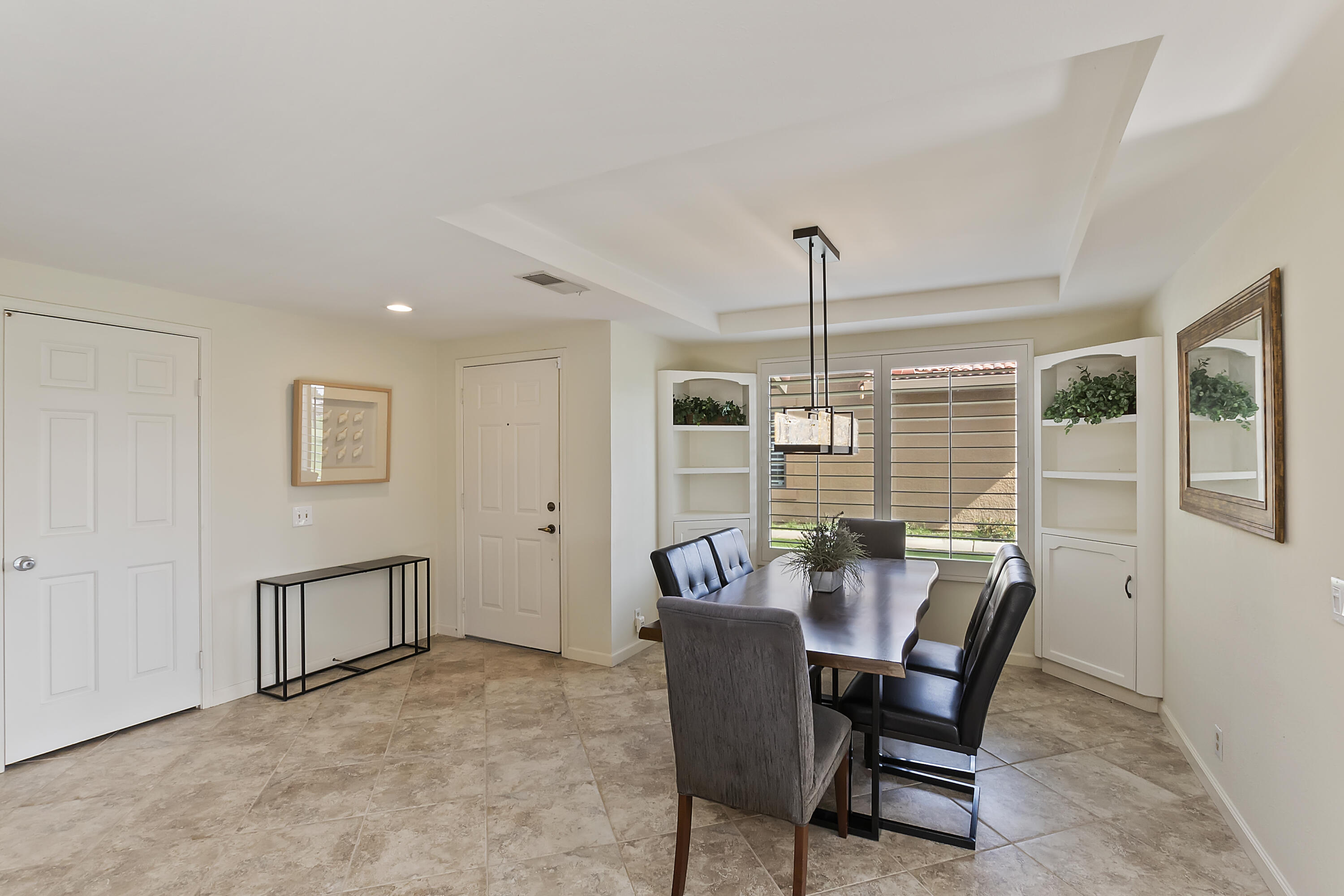 6 Maximo Way Palm Desert, CA 92260 - Photo 9 of 48 a dining room with furniture and window