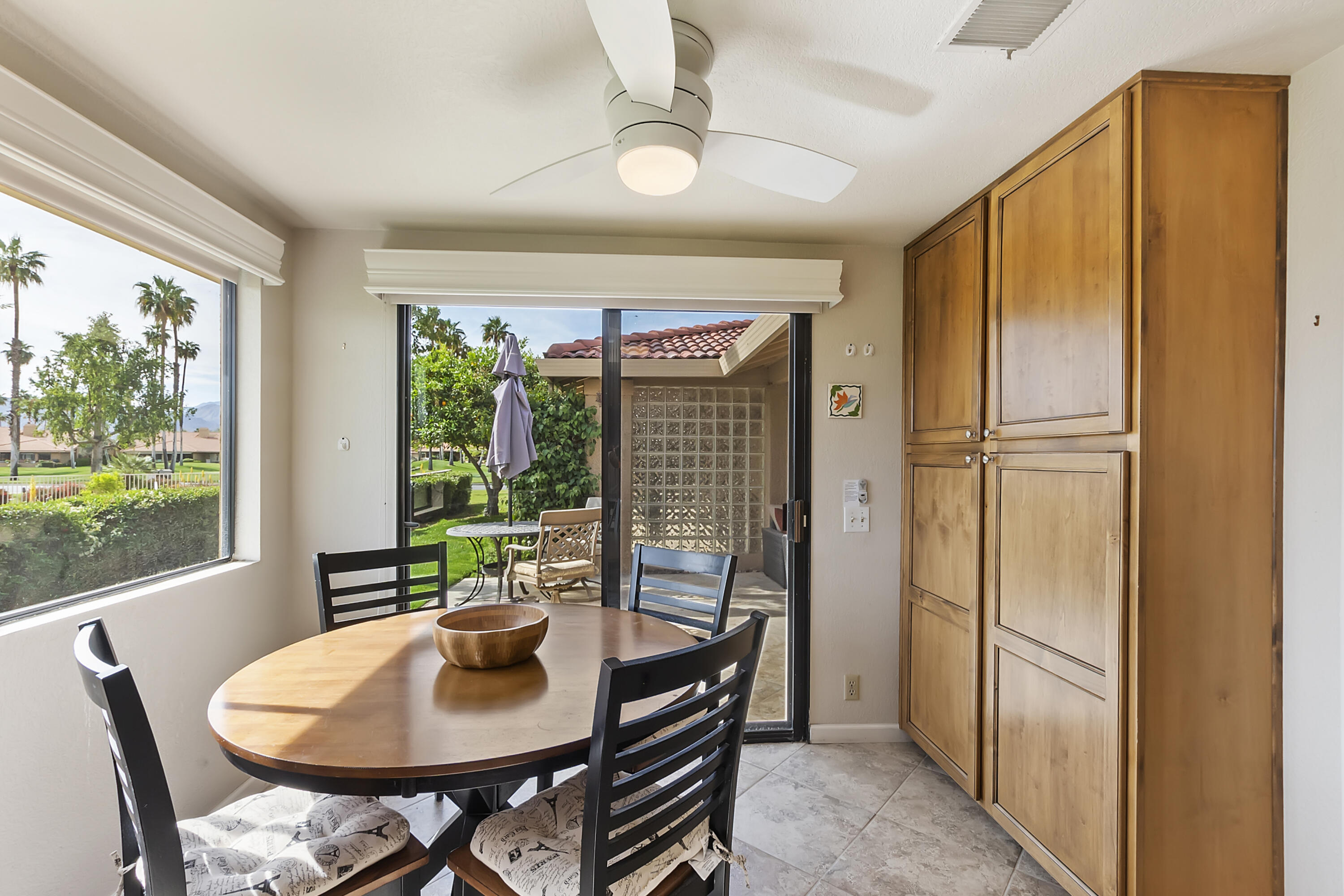 6 Maximo Way Palm Desert, CA 92260 - Photo 10 of 48 a view of a dining room with furniture window and outside view