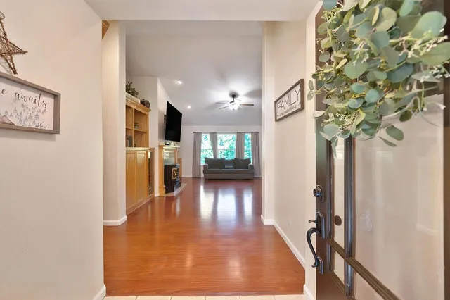 a room with furniture a piano and wooden floor