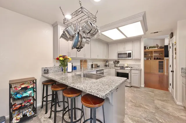 a bathroom with double vanity sinks a mirror and a shower