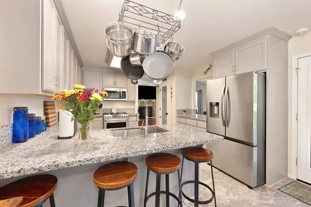 a spacious bathroom with a double vanity sink and a mirror