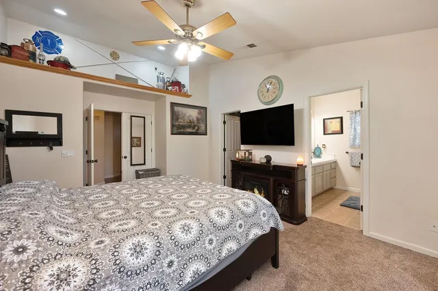 a view of a swimming pool with a patio and a yard