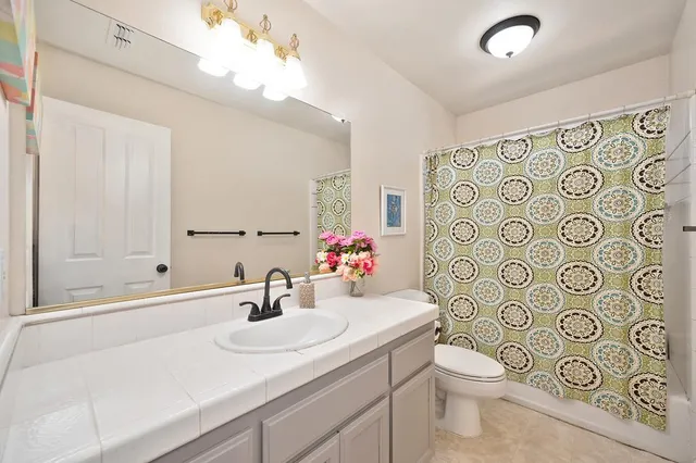 a view of yard with large trees