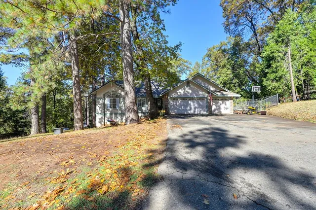 a view of house with snow on the road