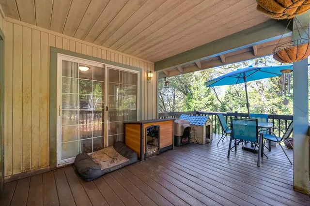 a view of a house with a tree