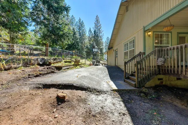 a view of a city with lush green forest