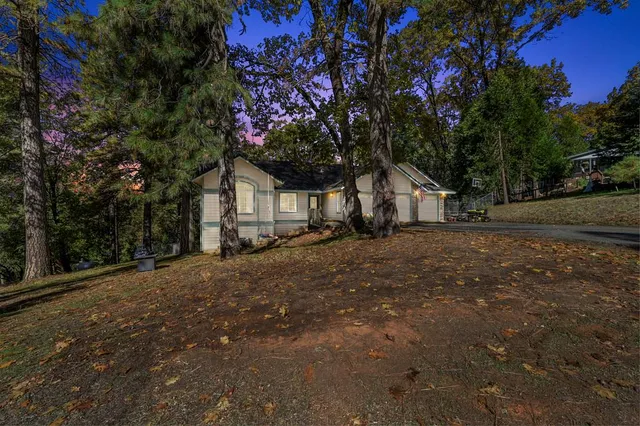 a view of a house with a tree