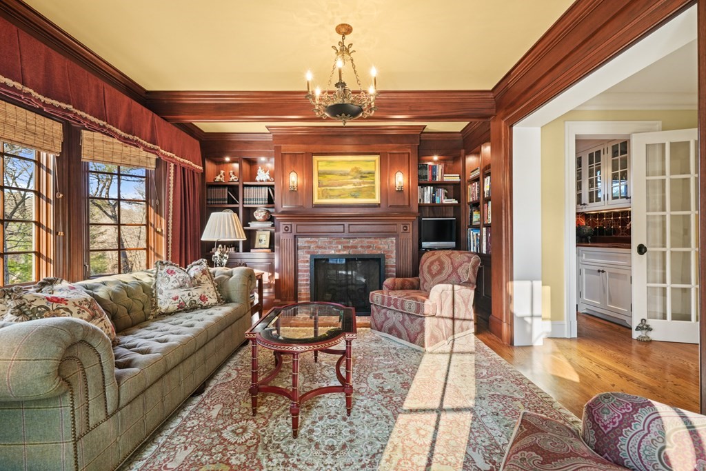 111 Livingston Road Wellesley, MA 02482 - Photo 11 of 42 a living room with furniture a fireplace and a chandelier