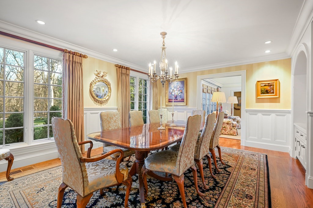 111 Livingston Road Wellesley, MA 02482 - Photo 13 of 42 a dining room with furniture a chandelier and wooden floor