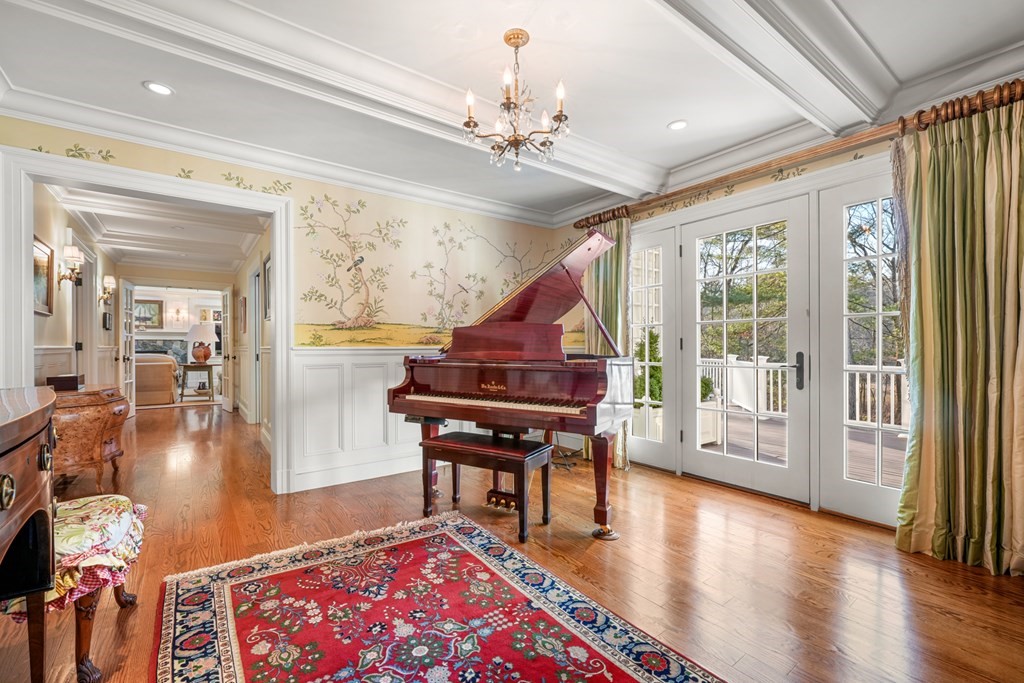 111 Livingston Road Wellesley, MA 02482 - Photo 15 of 42 a living room with a piano and a table