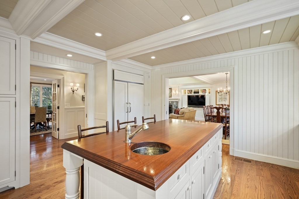 111 Livingston Road Wellesley, MA 02482 - Photo 19 of 42 a dining hall with stainless steel appliances granite countertop a sink a counter space and living room view