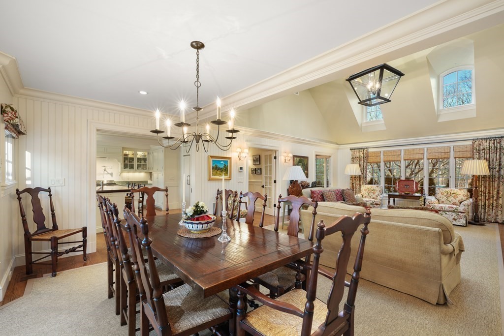 111 Livingston Road Wellesley, MA 02482 - Photo 22 of 42 a view of a dining room and livingroom with furniture wooden floor a chandelier