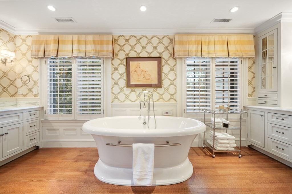 111 Livingston Road Wellesley, MA 02482 - Photo 32 of 42 a spacious bathroom with a sink a bathtub and next to a window