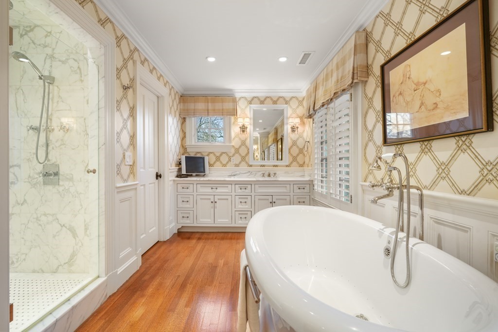 111 Livingston Road Wellesley, MA 02482 - Photo 33 of 42 a bathroom with a tub sink and mirror