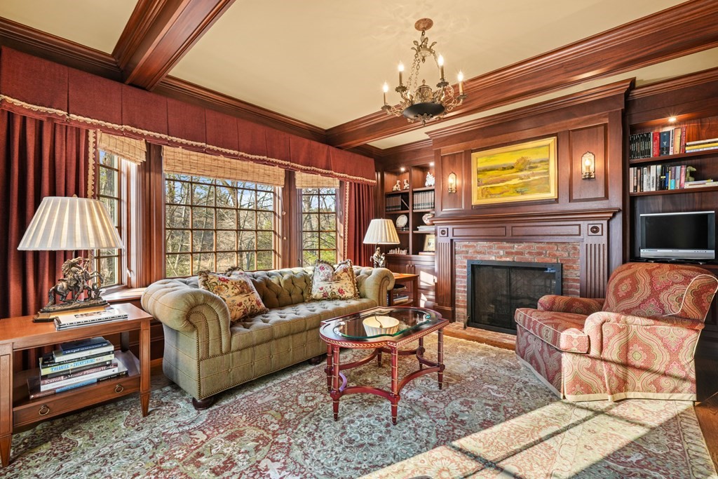 111 Livingston Road Wellesley, MA 02482 - Photo 10 of 42 a living room with furniture a fireplace and a chandelier