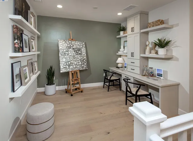 a room with furniture and a painting on the wall