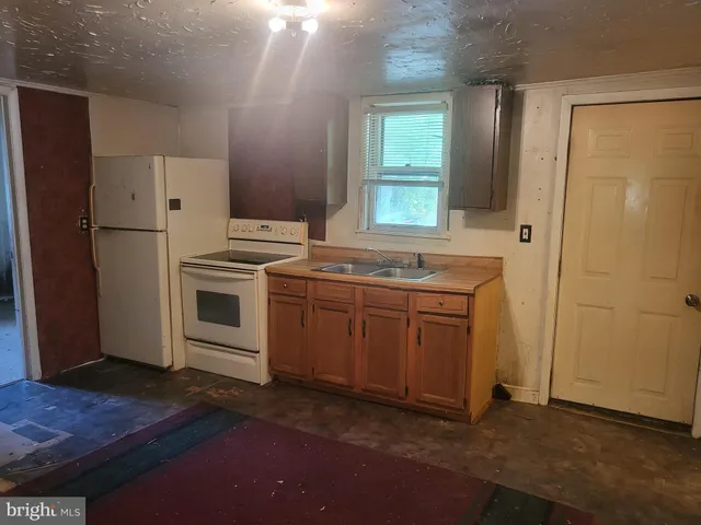 a view of a utility room with closet