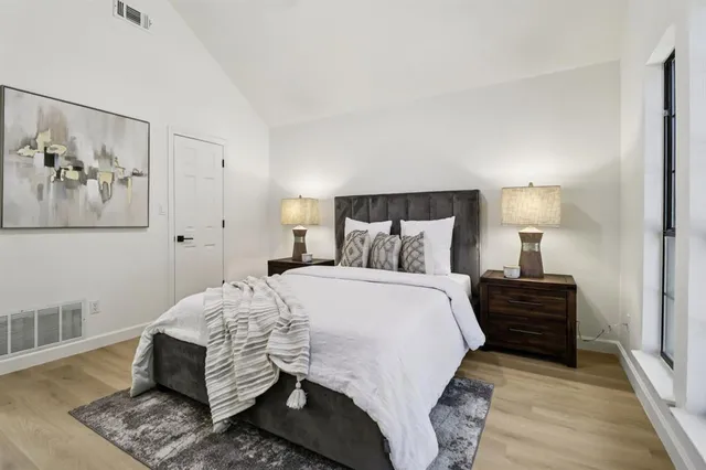 a bedroom with a bed and window