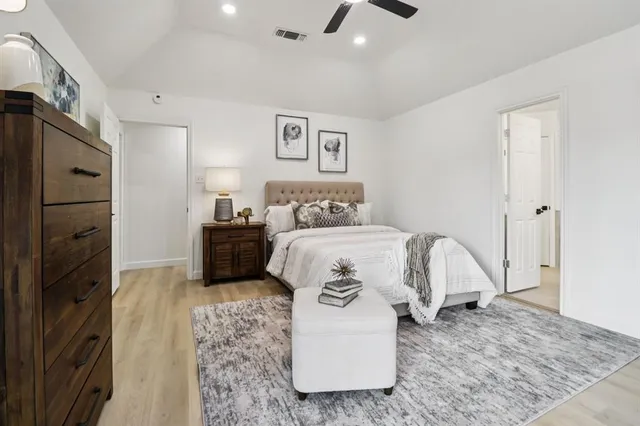 a bedroom with a bed and a couch