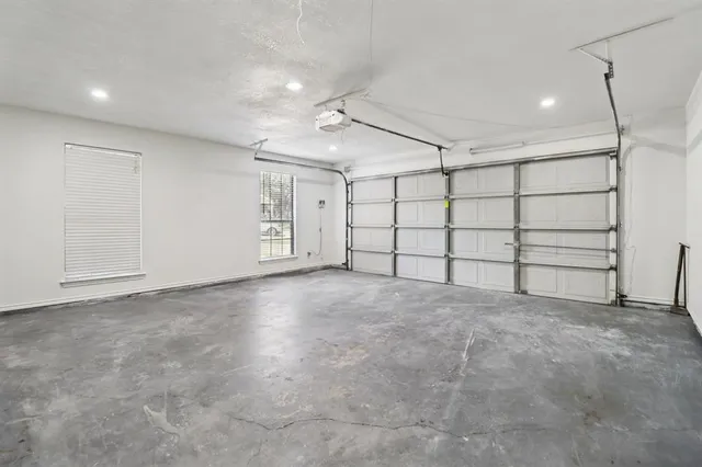 a view of a patio with a table and chairs