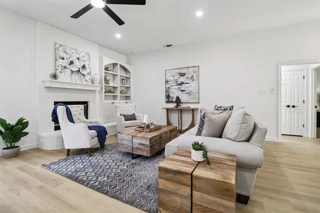 a bedroom with furniture and wooden floor