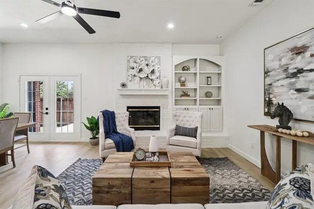 a living room with furniture a rug and a fireplace