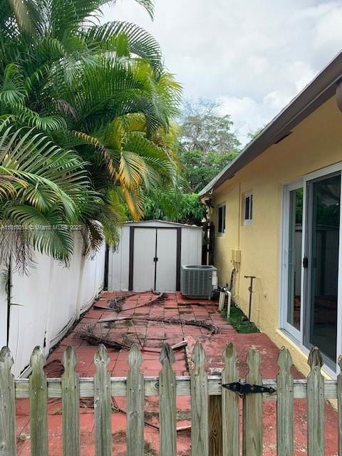 3490 Atlanta Street, Unit B Hollywood, FL 33021 - Photo 12 of 21 a backyard of a house with table and chairs