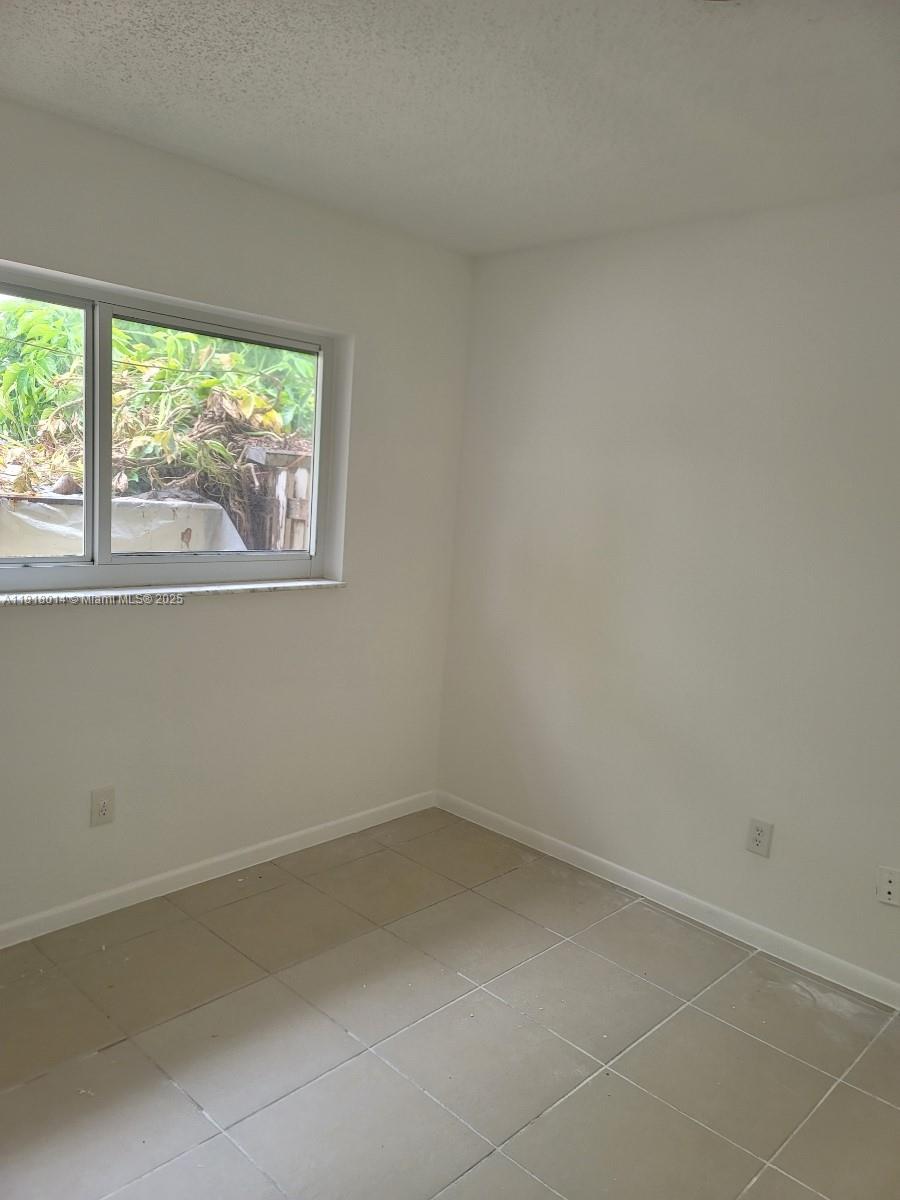 3490 Atlanta Street, Unit B Hollywood, FL 33021 - Photo 15 of 21 an empty room with a window