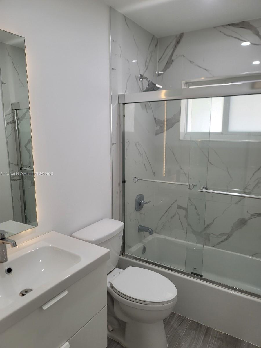 3490 Atlanta Street, Unit B Hollywood, FL 33021 - Photo 17 of 21 a bathroom with a sink a toilet and shower