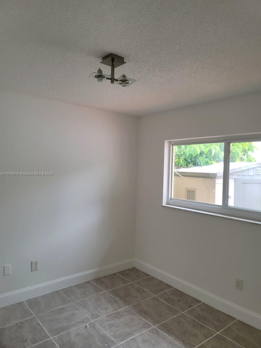 3490 Atlanta Street, Unit B Hollywood, FL 33021 - Photo 21 of 21 an empty room with a window