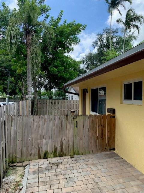 3490 Atlanta Street, Unit B Hollywood, FL 33021 - Photo 9 of 21 a backyard of a house with plants and tree