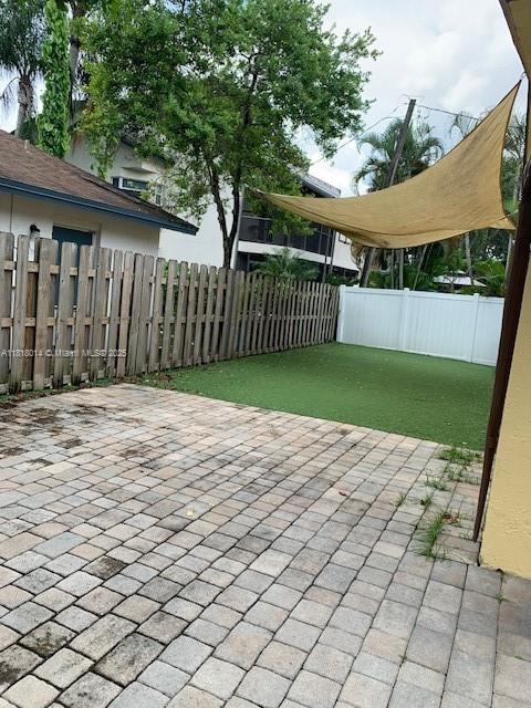3490 Atlanta Street, Unit B Hollywood, FL 33021 - Photo 10 of 21 a view of a deck with a white fence