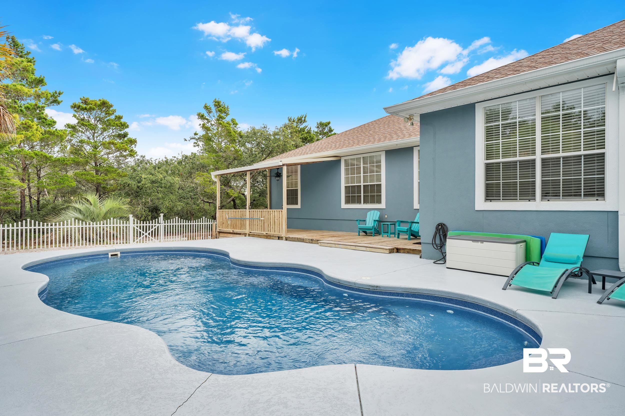 4606 Osprey Drive Orange Beach, AL 36561 - Photo 12 of 44 View of pool featuring a fenced backyard and a patio