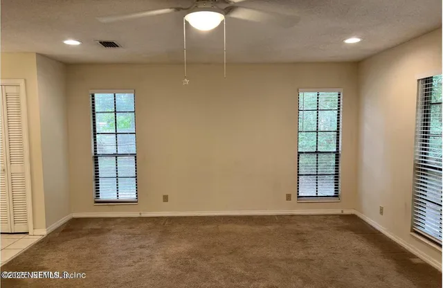 a bathroom with a toilet and a bath tub