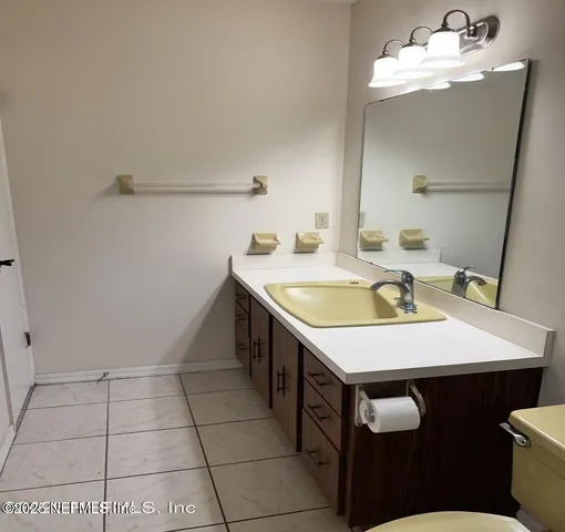 a en suite bathroom with a sink a mirror and a shower