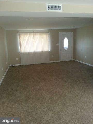 2121 Oak Road Edgemere, MD 21219 - Photo 2 of 8 an empty room that has a window