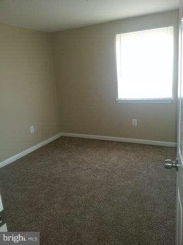 2121 Oak Road Edgemere, MD 21219 - Photo 7 of 8 an empty room with a window