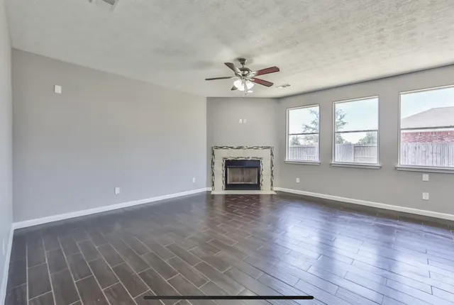 a view of a kitchen with a sink and microwave
