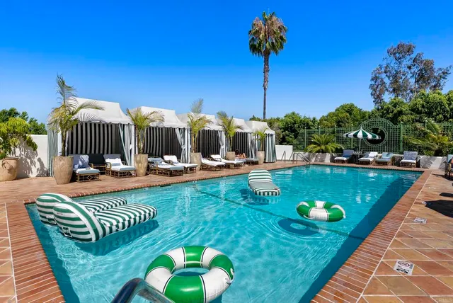 a view of small house with potted plants