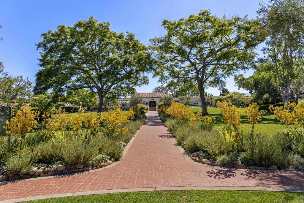 5929 Linea Del Cielo, Unit JACARANDA Rancho Santa Fe, CA 92067 - Photo 16 of 16 a view of a yard with plants and large trees
