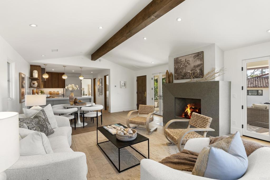 5929 Linea Del Cielo, Unit JACARANDA Rancho Santa Fe, CA 92067 - Photo 2 of 16 a living room with furniture and a fireplace