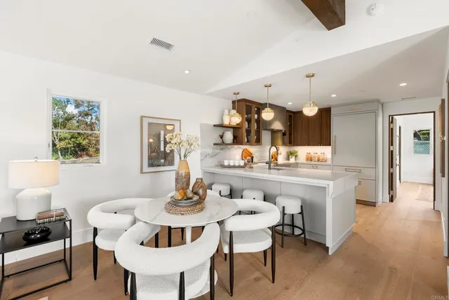 a kitchen with a refrigerator a sink and a stove