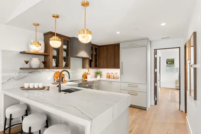 a kitchen with a sink and cabinets