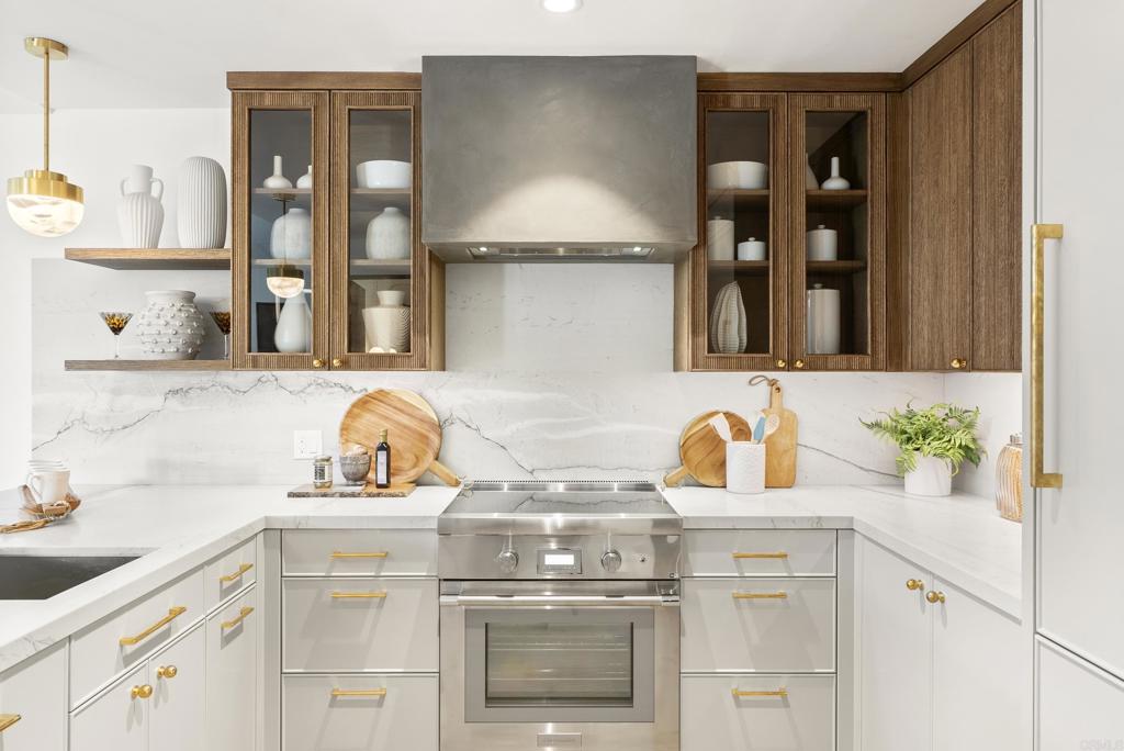5929 Linea Del Cielo, Unit JACARANDA Rancho Santa Fe, CA 92067 - Photo 5 of 16 a kitchen with a sink and cabinets