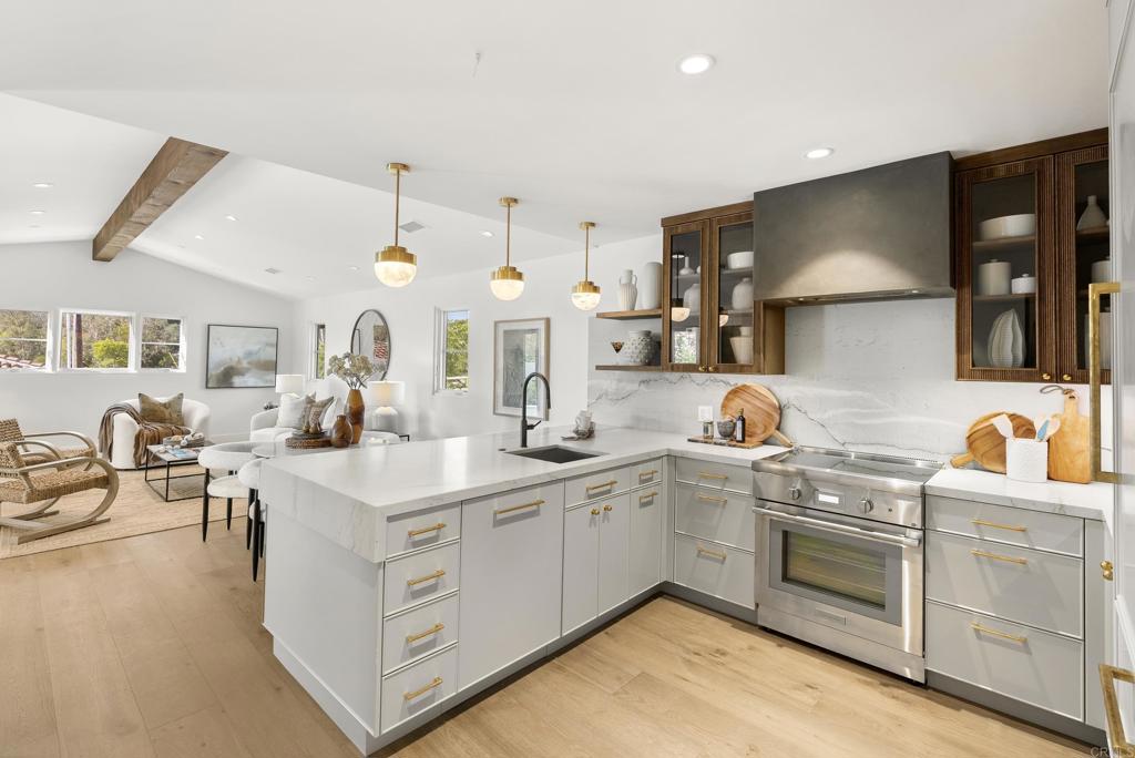 5929 Linea Del Cielo, Unit JACARANDA Rancho Santa Fe, CA 92067 - Photo 6 of 16 a kitchen with white cabinets and sink