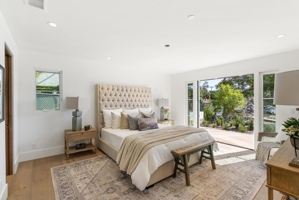 5929 Linea Del Cielo, Unit JACARANDA Rancho Santa Fe, CA 92067 - Photo 7 of 16 a bedroom with a bed and a large window