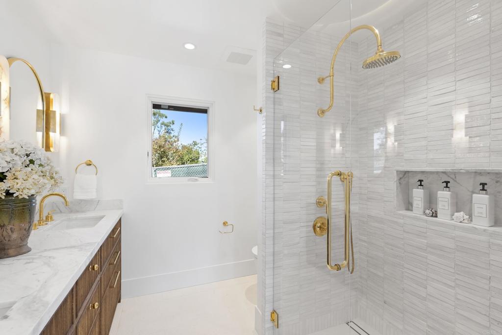 5929 Linea Del Cielo, Unit JACARANDA Rancho Santa Fe, CA 92067 - Photo 10 of 16 a bathroom with a sink tub and a mirror