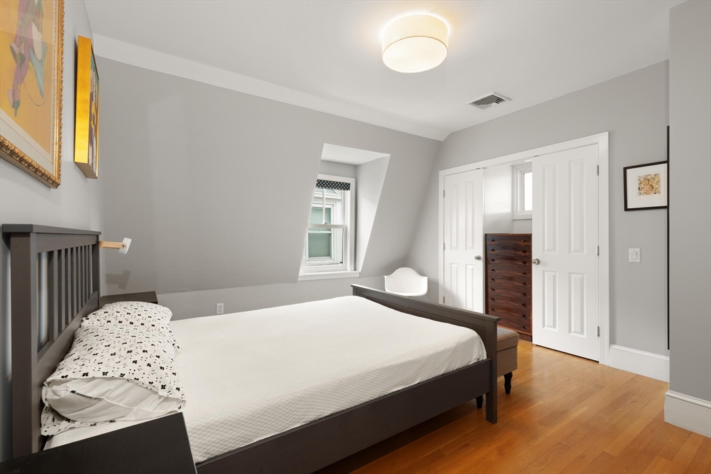 36 Gorham Street, Unit 3 Cambridge, MA 02138 - Photo 13 of 31 a bedroom with a bed and a dresser