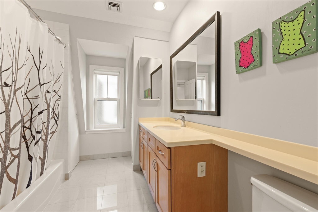 36 Gorham Street, Unit 3 Cambridge, MA 02138 - Photo 14 of 31 a bathroom with a sink and a mirror